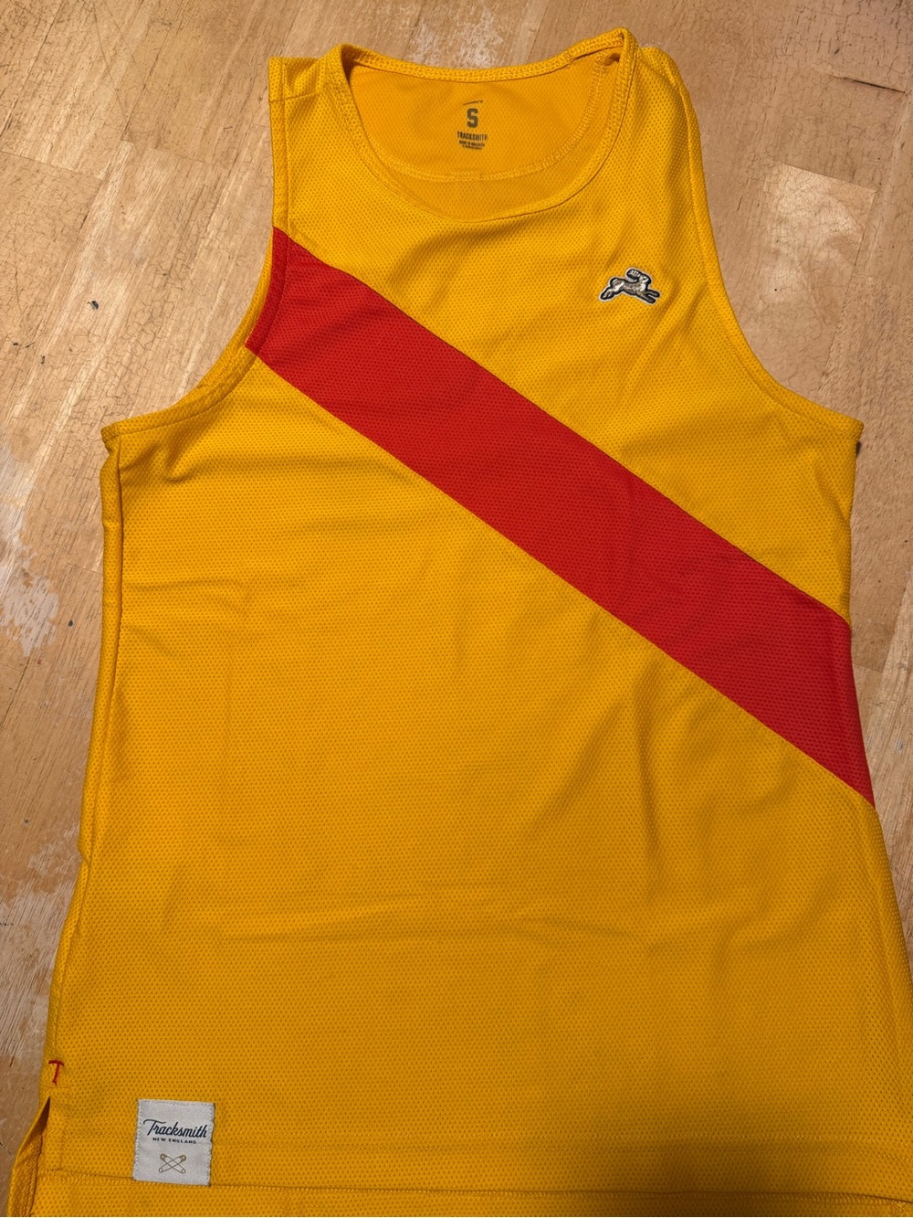Women’s Tracksmith light orange Van Cortland Tank Singlet